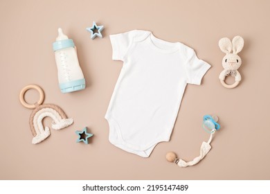 Flat Lay With Baby Sleep Accessories With Pacifier, Pajamas And Toys. Newborn Sleeping Rules Concept. Onesie Mockup