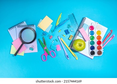 Flat Lay Background With Colorful Educational  Supplies On Bright Blue Background. Back To School Concept. School Backpack With Scissors, Notepads, Pen, Pencils, Supply. Top View, Overhead Copy Space