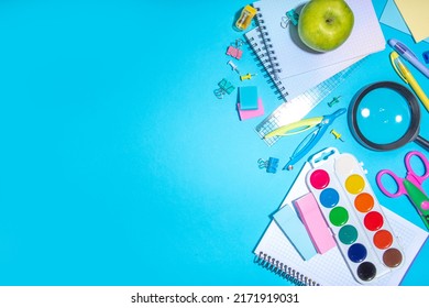 Flat Lay Background With Colorful Educational  Supplies On Bright Blue Background. Back To School Concept. School Backpack With Scissors, Notepads, Pen, Pencils, Supply. Top View, Overhead Copy Space