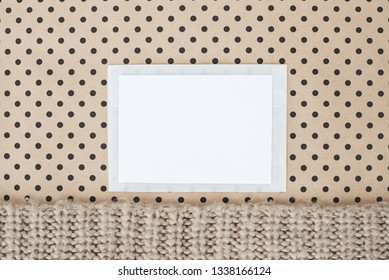 flat, lay,  background with white paper sheet for text,  top view,   polka dots  natural color knitting wool - Powered by Shutterstock