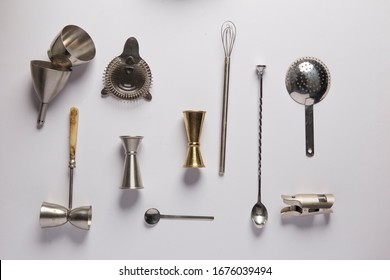 Flat Lay With Bartender Tools For Mixology And Cocktail Making, Such As Shaker,mixing Glass, Stirring Spoon, Jigger And Filter.