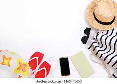 Flat Lay Of Beach Accessories And Blank Smart Phone For Text On White Background. Tourism And Summer Vacation Background