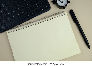 flat lay of a blank note book for text space. Educational and financial concept with text space on plain background. surrounded by office tools.