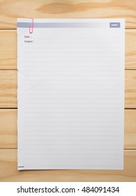 Flat lay of blank paper sheet on desk with copy space