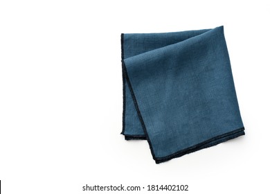 Flat lay with blue linen kitchen napkin isolated on white background. Folded cloth for mockup with copy space, top view