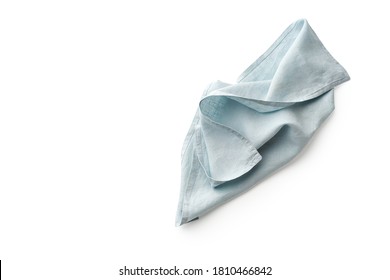 Flat Lay With Blue Linen Rustic Kitchen Napkin Isolated On White Background. Overhead Image Of Folded Cloth For Mockup, Copy Space