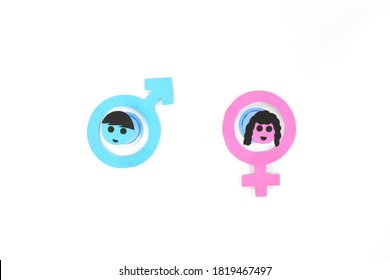 Flat Lay Of Blue Male Symbol And Pink Female Symbol Side By Side. Marriage, Gender Equality, Feminine Versus Masculine, Man Vs Woman Concept.