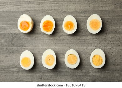 Flat lay with boiled eggs on gray background, top view