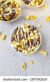 Flat Lay Bowl Of Chocolate Drizzled Popcorn