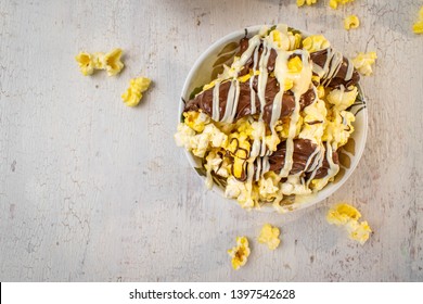 Flat Lay Bowl Of Chocolate Drizzled Popcorn