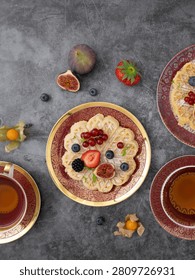 Flat lay breakfast scene featuring homemade pancake waffles with fresh fruit toppings