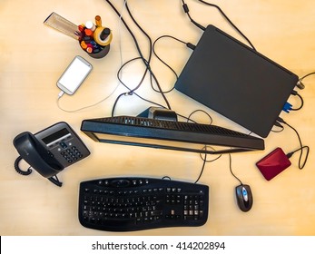 Flat Lay Of A Business Desktop With Accessories:  Computer,  Keyboard,  Monitor,  Mouse,  Tablet,  Smartphone,  Pen Holder,  Desk Phone And A Hard Disk.