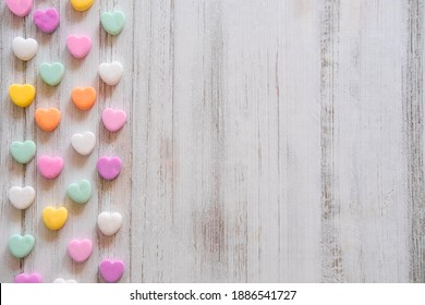 Flat Lay Candy Hearts Pattern - Pastel Rainbow Conversation Heart Candy Design For Valentine's Day. Top View Sweet Decor For Easter.