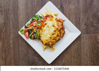 Flat Lay Chicken Parmigiana With Chips