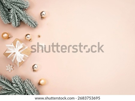 Flat lay Christmas composition of tree balls branches and gift box.Empty copy space top view xmas backdrop, border,frame. new year banner.