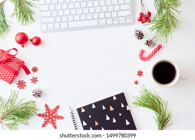 Flat Lay Christmas Home Office Desk With Pine Branches And Keyboard, Christmas Decorations  On A White Background