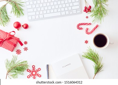 Flat Lay Christmas Home Office Desk With Pine Branches And Keyboard, Christmas Decorations  On A White Background