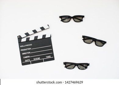 Flat lay Clapper and 3d glasses. Cinema concept of starting or editing production videos. Horizontal composition Top view
Movie clapper on white background. Black and white image. With place for text.