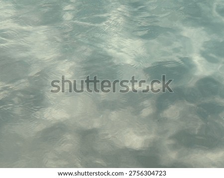 Flat Lay Close Up Of Still Clear Ocean Water With Light Reflections Sand Base And Copy Space Background