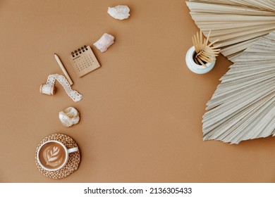 Flat Lay With Coffee Cup, Dry Green Palm Leaf On Beige Background. Aesthetic Wedding Planning Or Invitation