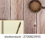 Flat Lay Of Coffee Cup And Notebook With Pen On Wooden Desk With Copy Space 