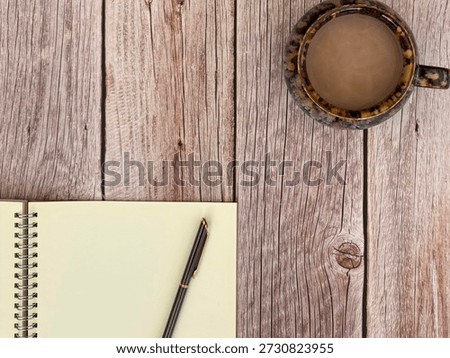 Flat Lay Of Coffee Cup And Notebook With Pen On Wooden Desk With Copy Space 