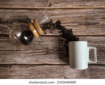 Flat lay of a coffee cup, scattered coffee beans, and a coffee filter on a rustic wooden surface - Powered by Shutterstock