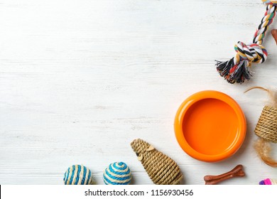 Flat Lay Composition With Accessories For Dog And Cat On Wooden Background. Pet Care