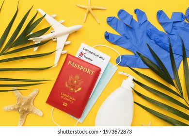 Flat Lay Composition With American Passport With Coronavirus Test Results, Mask And Other Hygiene Products On Colored Background.