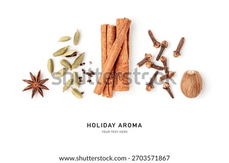 Flat lay composition of aromatic spices isolated on white background. Cinnamon sticks, nutmeg, star anise, cardamom and cloves photography. Minimal festive layout. Natural aroma