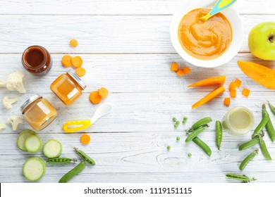 Flat Lay Composition With Baby Food And Ingredients On Wooden Background