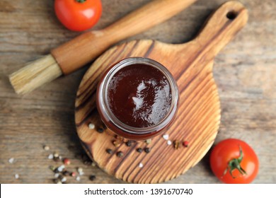 Flat Lay Composition With Barbecue Sauce On Wooden Background