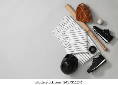 Flat lay composition with baseball uniform on white background. Space for text