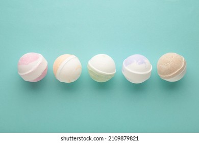 Flat lay composition with bath bombs on blue background. Top view
