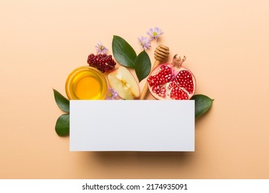 Flat lay composition with Blank flyer poster and symbols jewish Rosh Hashanah holiday attributes on colored background, New Year holiday Traditional. Top view with copy space mock up. - Shutterstock ID 2174935091