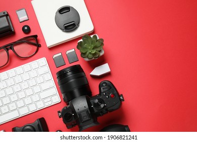 Flat Lay Composition With Camera And Video Production Equipment On Red Background. Space For Text