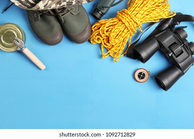 Flat Lay Composition With Camping Equipment On Color Background