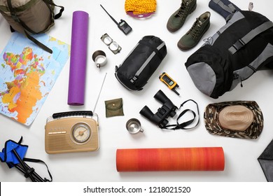 Flat Lay Composition With Camping Equipment On White Background