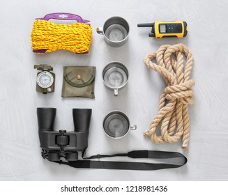 Flat Lay Composition With Camping Equipment On Grey Background