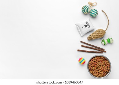 Flat Lay Composition With Cat Accessories And Food On White Background