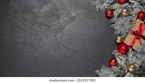 Flat lay composition with Christmas decor on grey textured background, space for text