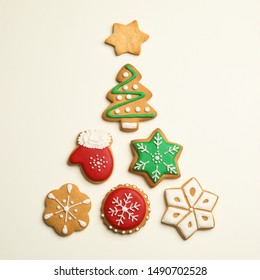 Flat lay composition with Christmas tree made of cookies on light background