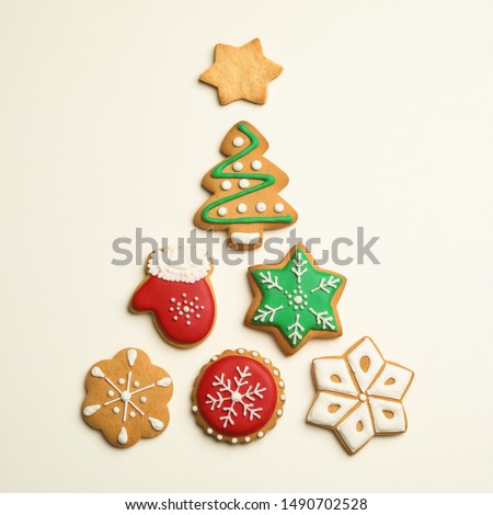 Flat lay composition with Christmas tree made of cookies on light background