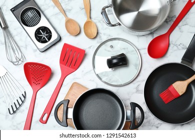 Flat lay composition with clean cookware on marble background