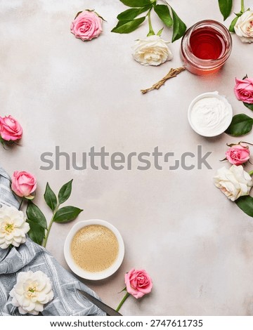 Flat lay composition with coffee, honey, cream, and fresh roses on a light stone background. Elegant morning breakfast concept with floral decoration, top view with copy space for text.
