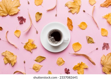 Flat lay composition with colorful Autumn cup of coffee and leaves on a color background. top view. - Powered by Shutterstock