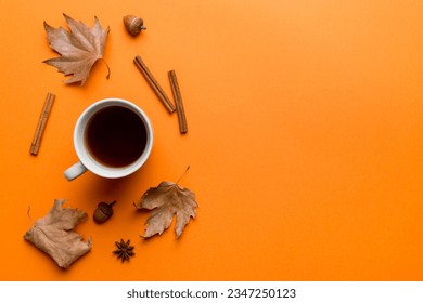 Flat lay composition with colorful Autumn cup of coffee and leaves on a color background. top view. - Powered by Shutterstock