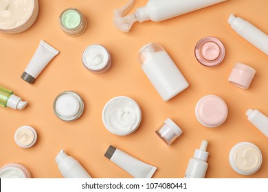 Flat lay composition with cosmetic products on color background