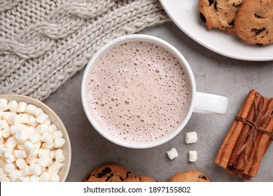 Flat lay composition with cup of delicious hot cocoa on grey table - Powered by Shutterstock