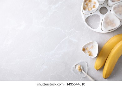 Flat lay composition with cups of banana yogurt on table, space for text. Multi cooker recipe - Shutterstock ID 1435544810